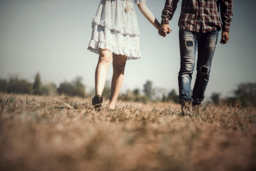 Couples holding hands while walking