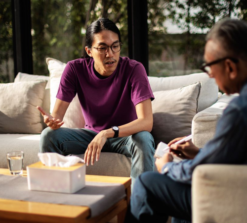 male-man-patient-eyeglasses-talking-with-therapist-cognitive-processing-therapy-(CPT)